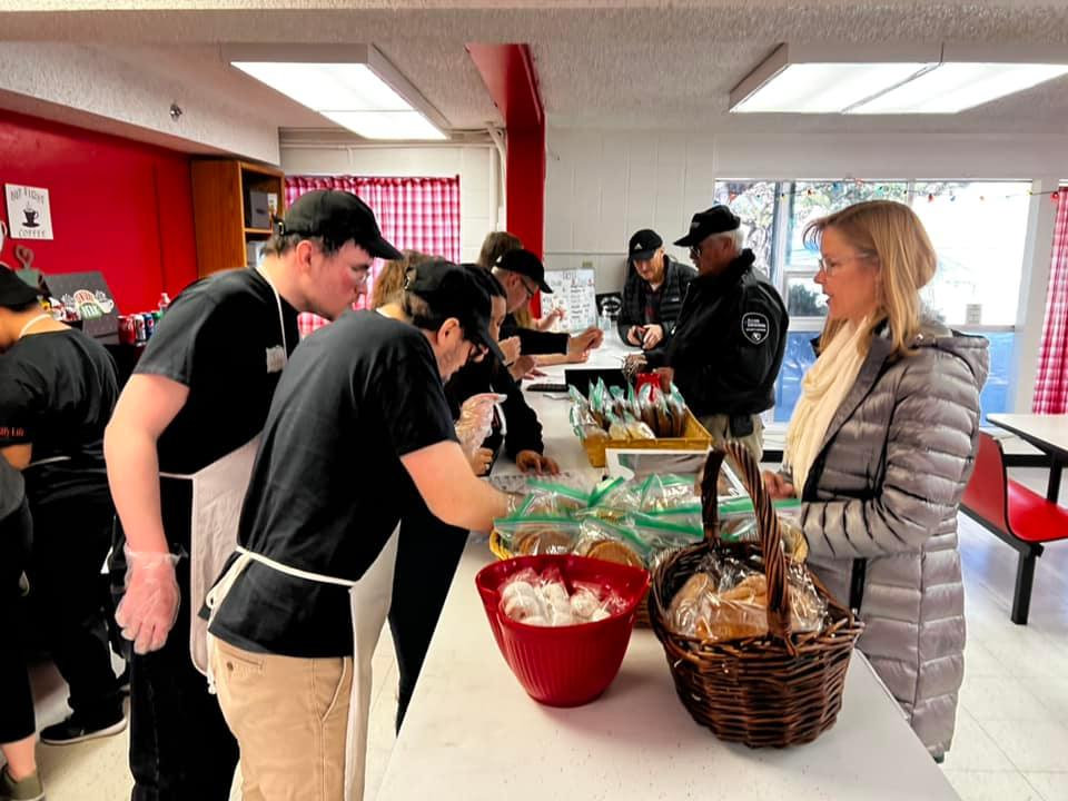 Café Canteen participants preparing food in the kitchen