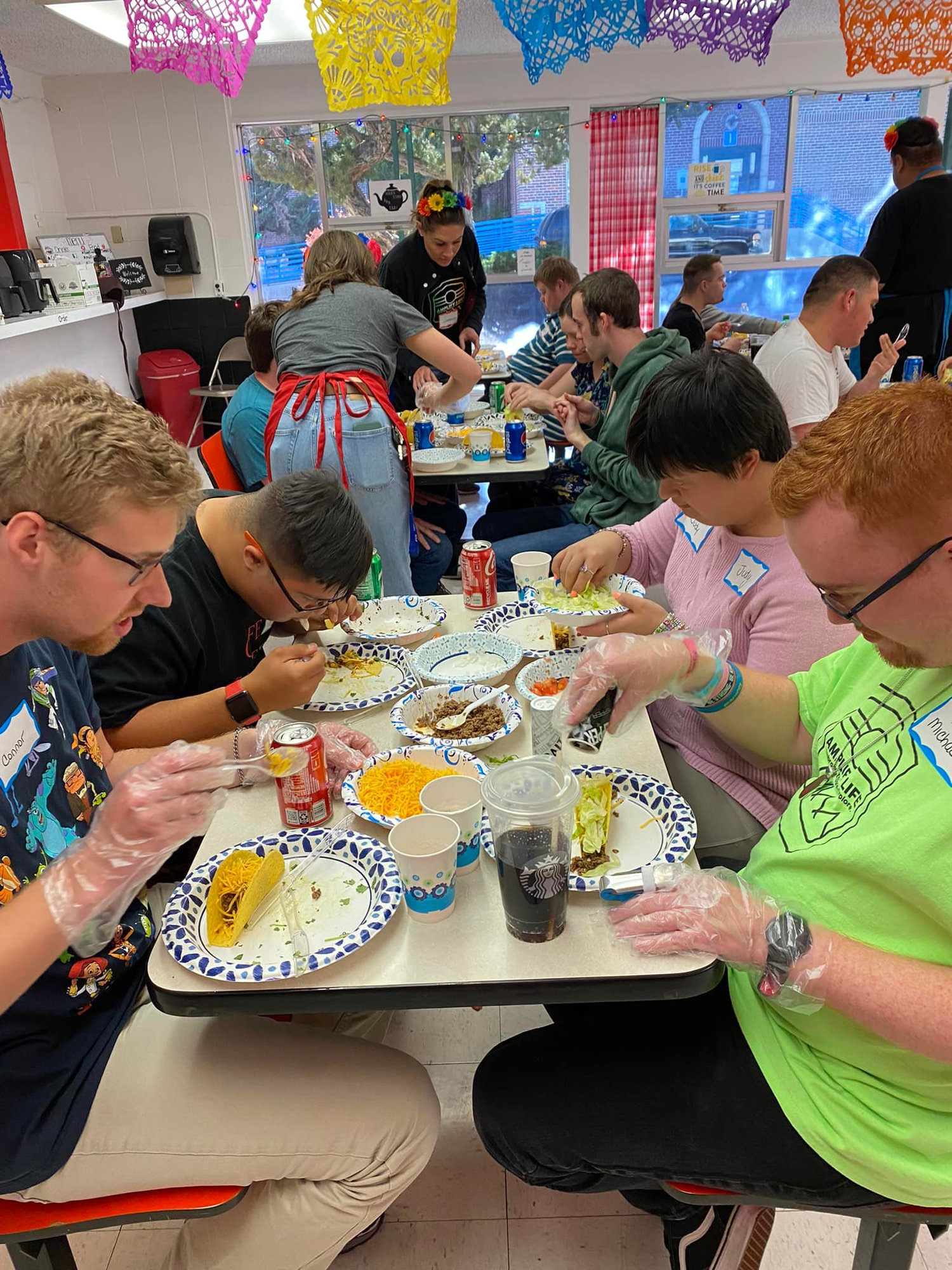 Participants sharing a meal at the Cinco de Mayo Fiesta