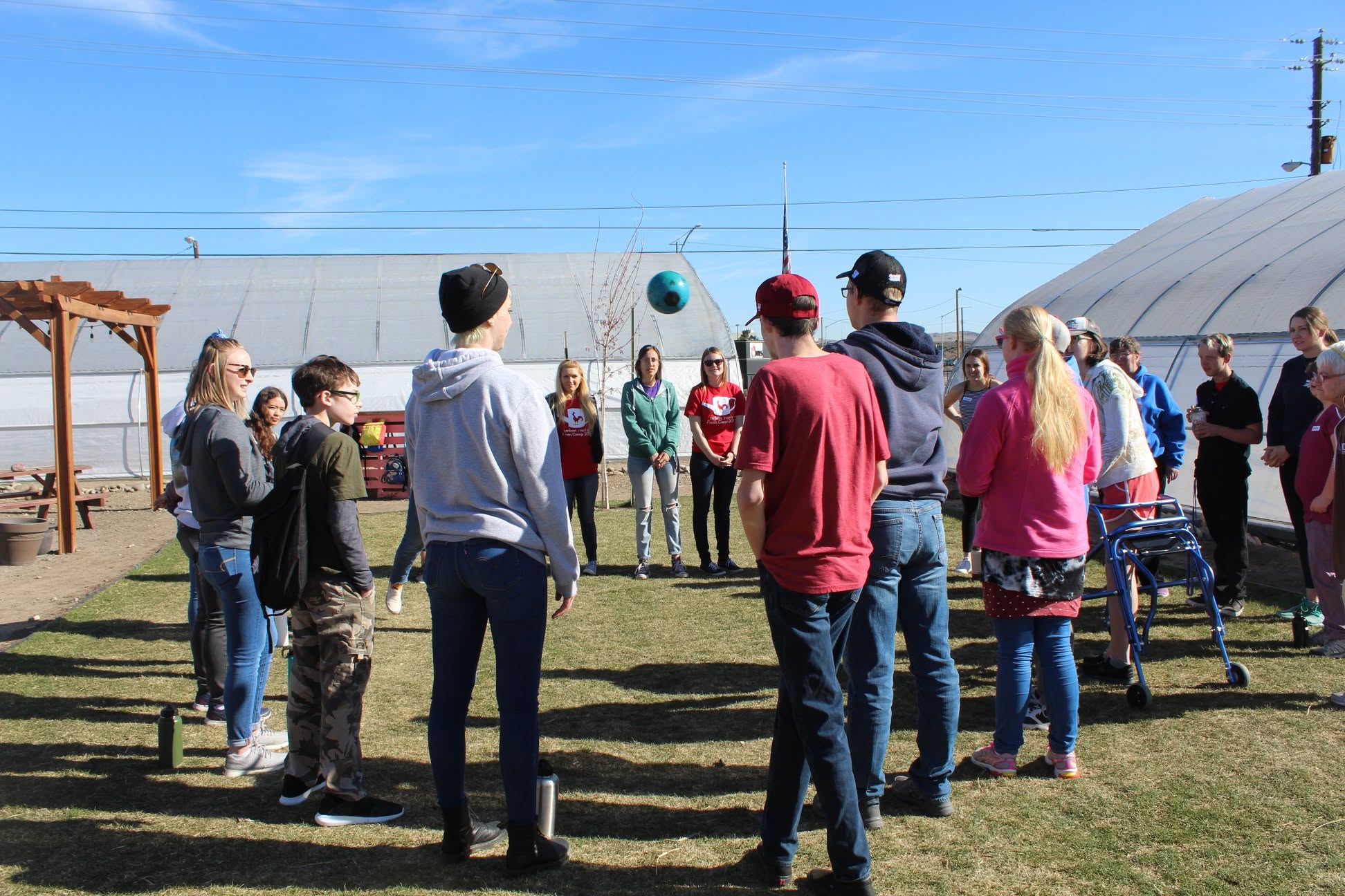 Group touring the greenhouses at Amplify the Farm