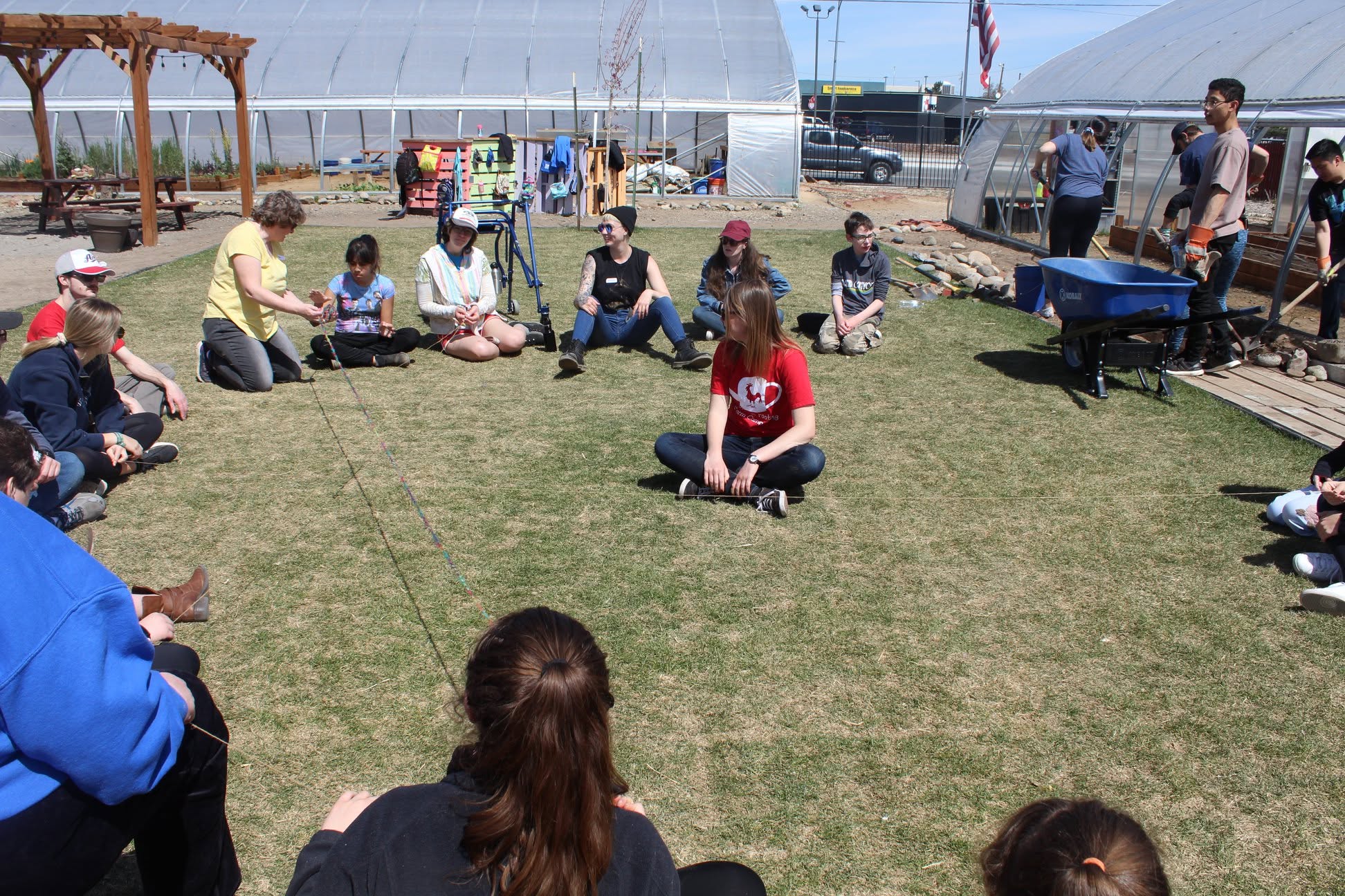 Group sitting in a circle on the grass