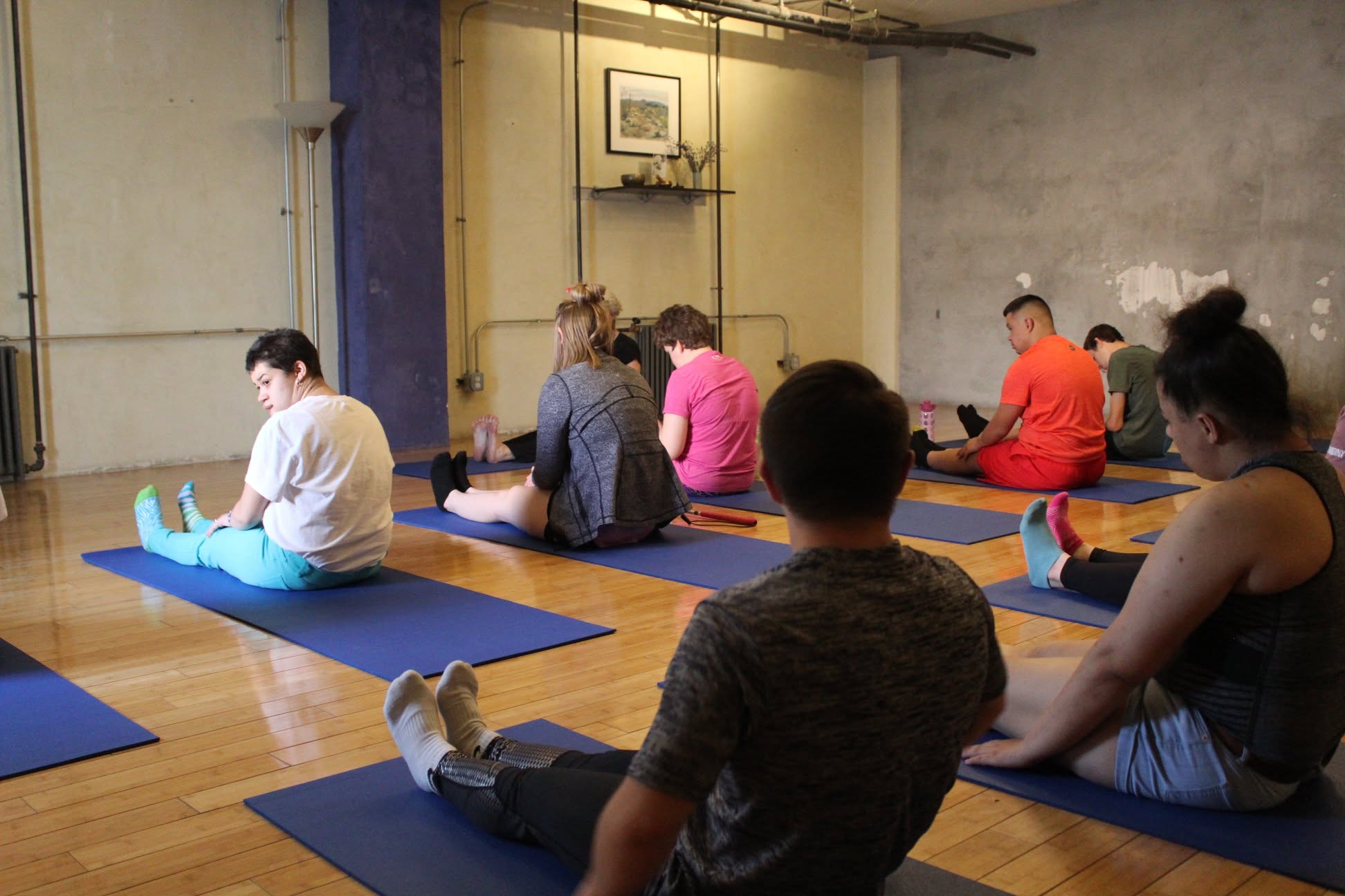 Group stretching together at a yoga class